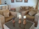High quality grass wicker,natural shade, consisting of couch,two side chairs and coffee table with drk glasstop retail 2700. Us reduced to 1000. Us email corizone@hotmail. Com for info currently in new storage facility since 5 weeks a few min outside sosua