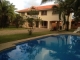 Located in Playa Chiquita, Sosua, less than 100 yards from the ocean's edge recipient of constant cool breeze, is this two level 3 bedroom, 3 bath Caribbean styled villa on a large lot size of 1675 meters. Consisting of a ground level with one bedroom and one bathroom, with kitchenette this unit is essentially separate from the main house upstairs. The ground level also offers roofed parking for 2 vehicles.
Through the main entrance the ceramic tiled stairs lead you to the open plan kitchen/dining area that in turn takes you onto the open terrace. Upstairs there are two bedrooms with en-suite bathrooms, all tiled in ceramic, the doors and closets are built from treated pine wood.
The main attraction from this house is the large lot, which offers numerous possibilities for future constructions, such as apartment buildings...or if you do like having space around you, then leaving the tropical gardens intact will provide you with the privacy you require. Please email if interested at mike@pasorobles.com
Offered fully furnished, this property also comes with a large pool, inverter power system,air conditioning in the bedrooms, water cistern, electronic gate and much more. Contact: mike@pasorobles.com