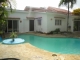 This unfurnished 3 bedroom, 3 bathroom villa is situated in a
gated community in the hills of Sosua, just 10 minutes drive to 
center, shopping and beaches.
Entering the beautiful tropical garden with colorful flowers, orchids and palm trees, the walk way from natural stone with night lights leads you to the villa.
Huge open living/dining room with glass sliding doors and screens,
double kitchen in light color wood, plenty of windows, vaulted ceilings with fans make the villa all year round cool.
Master bedroom comes with air condition, all 3 bedrooms have en-suite bathrooms.
Master bath with bath tub for 3 or 4 people.
All bedrooms are spacious, include closets, fans and safes with combination and keys, direct access to garden and pool from each bedroom.
In front of the house is the swimming pool with pool bar and jacuzzi.
A high fence surrounds the entire property, guarantees the privacy and security.
Internet and cable available, phone lines are installed.
The pool pump house behind the villa has storage space.
Special features:
solar water heater for pool, ceiling fans with lamps, all vaulted ceilings,all sliding doors with screens, out door shower in stone, low maintenance of
3500 Pesos (100 USD) includes  water supply, garbage disposal and 24/7 security.
Motivated seller!
Looking for a spacious, tranquil house in a gated community with a
wonderful garden, this should be on your list! 